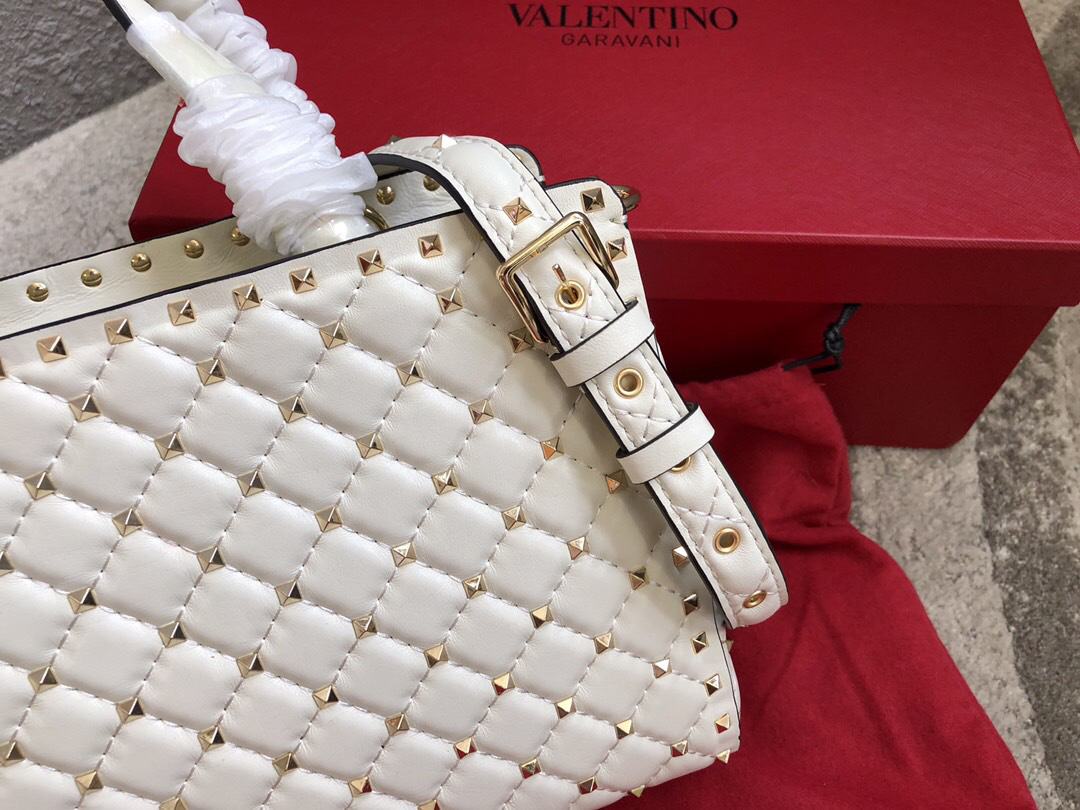 Va1e*ntin0 Garavani Rockstud Spike Lambskin Handbag in white