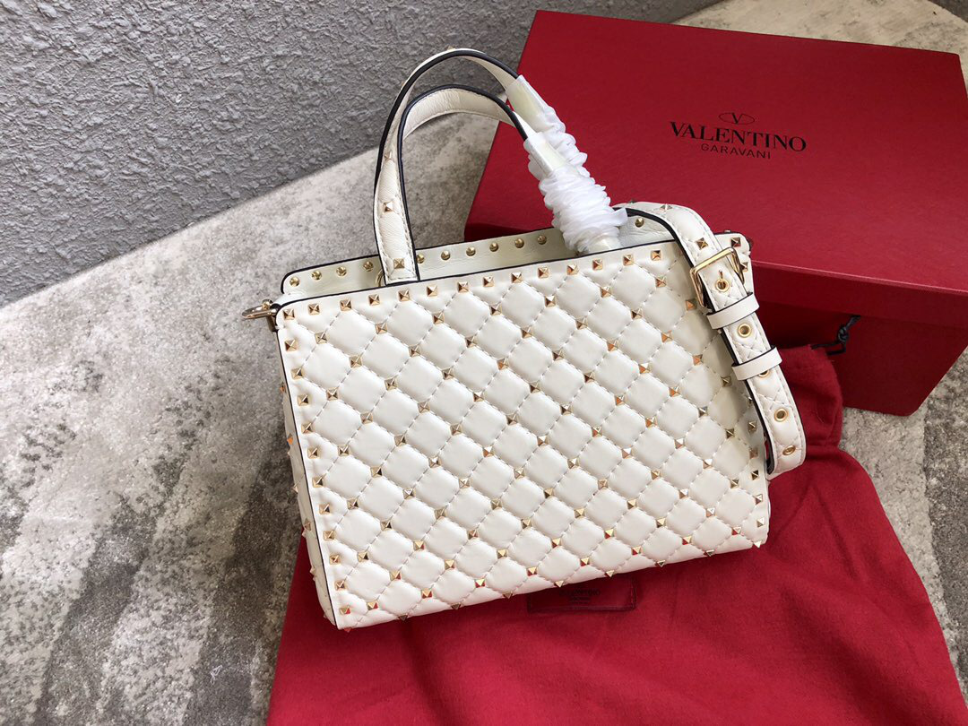 Va1e*ntin0 Garavani Rockstud Spike Lambskin Handbag in white