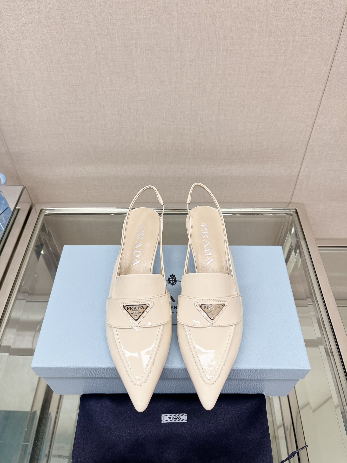 Bagsaaa Pra*a Patent white leather slingbacks (45 mm)