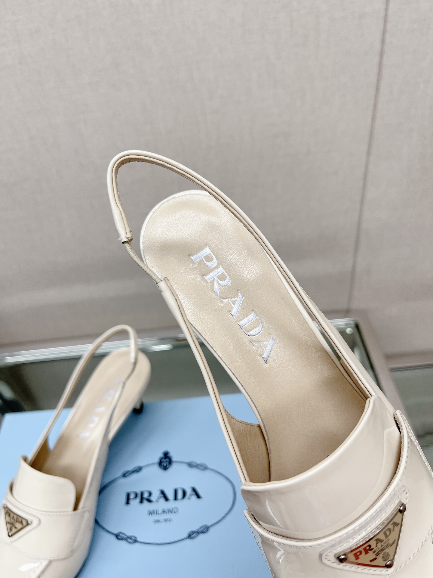 Bagsaaa Pra*a Patent white leather slingbacks (45 mm)