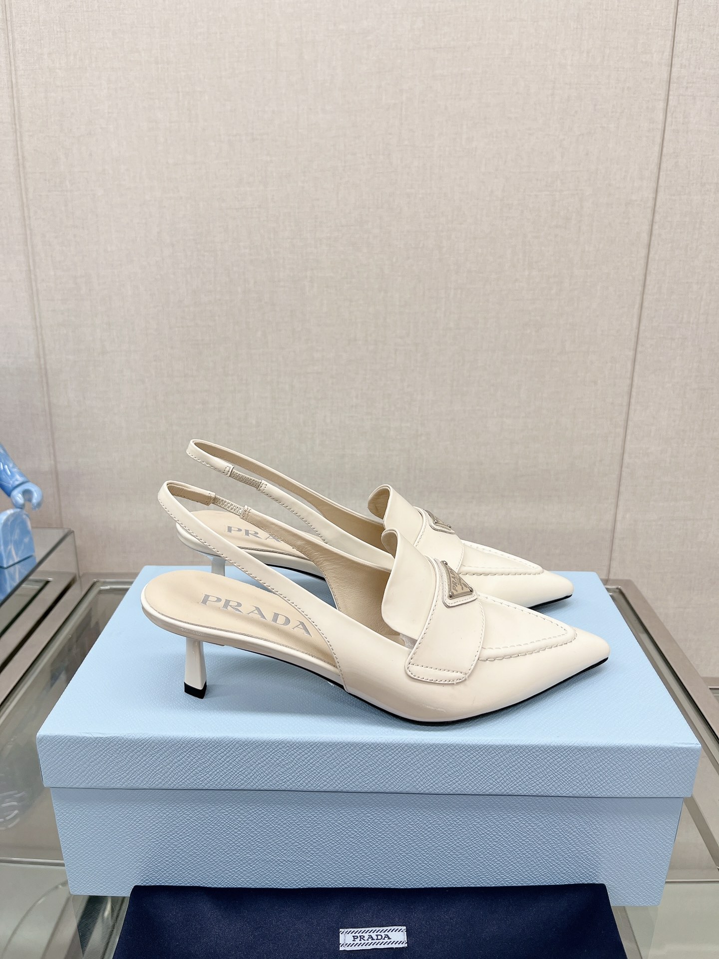 Bagsaaa Pra*a Patent white leather slingbacks (45 mm)