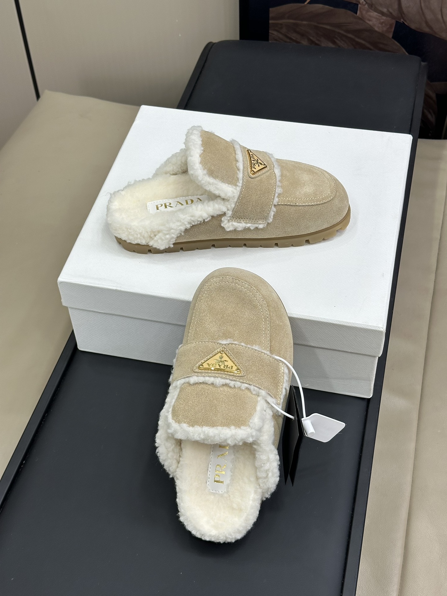 Bagsaaa Pra*a Suede and shearling slippers beige