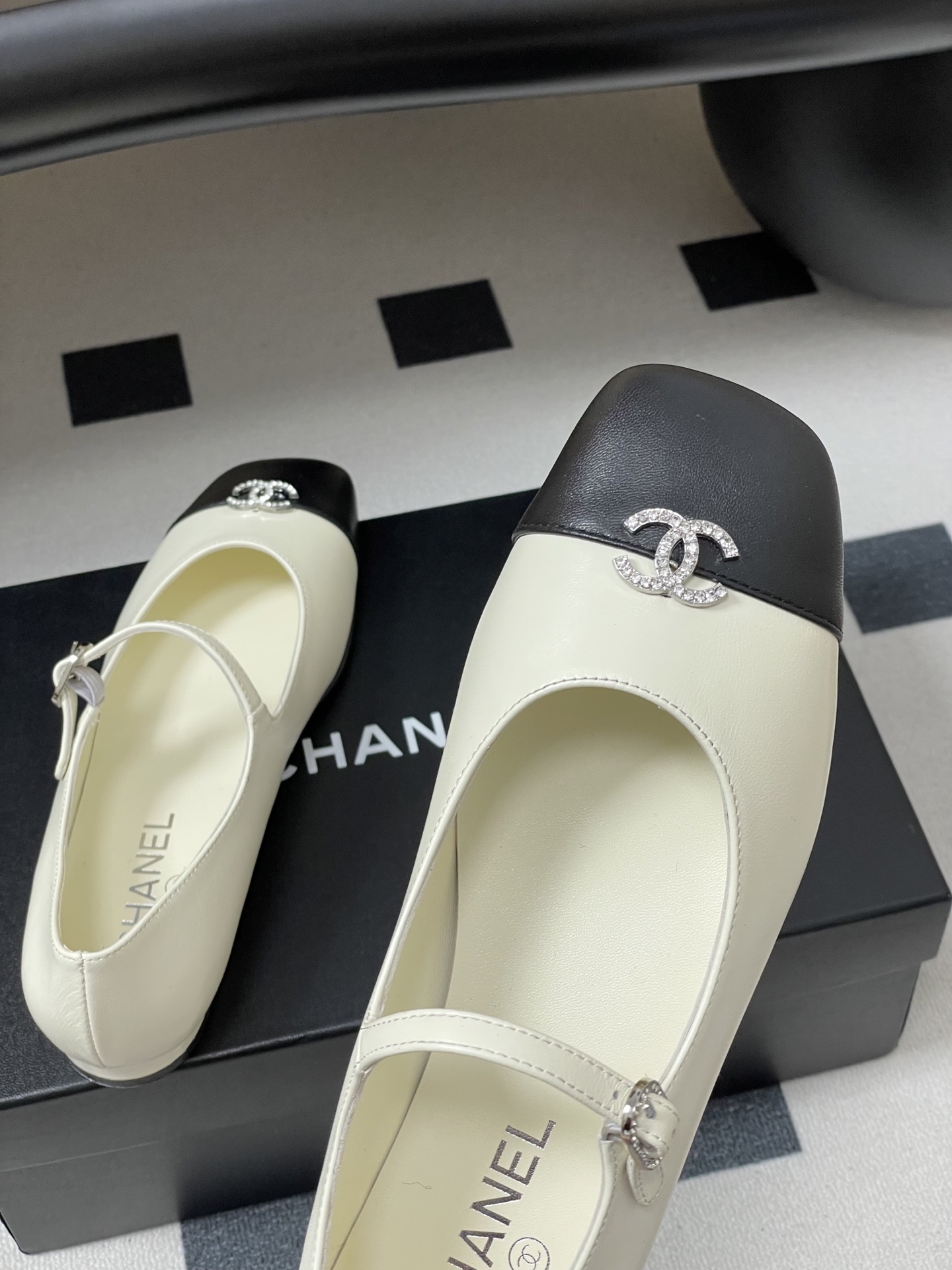 Bagsaaa Ch**el black & white Mary Jane flats with crystal-embellished CC