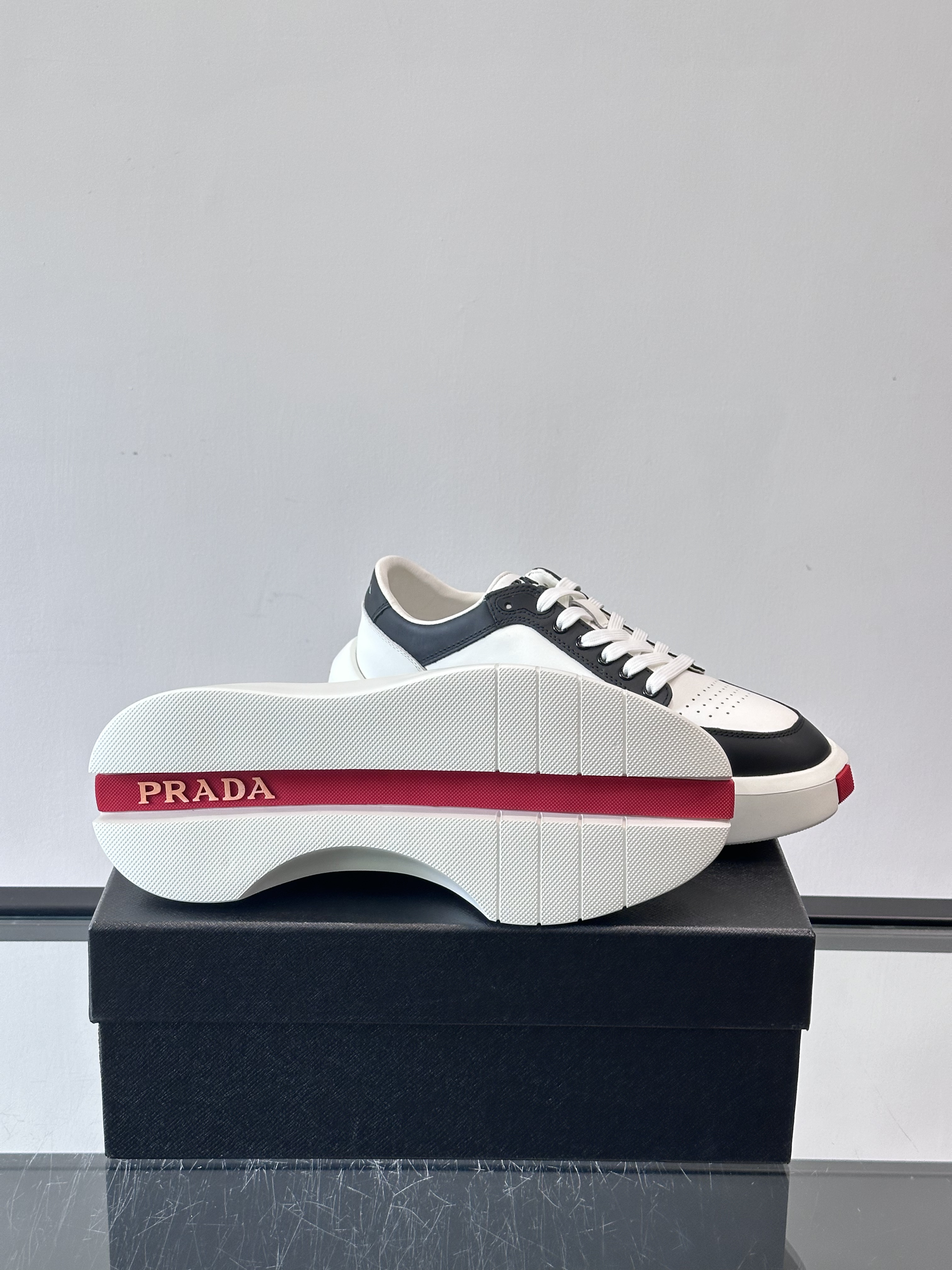 Bagsaaa Pra*a Downtown leather sneakers in a white and black colorway