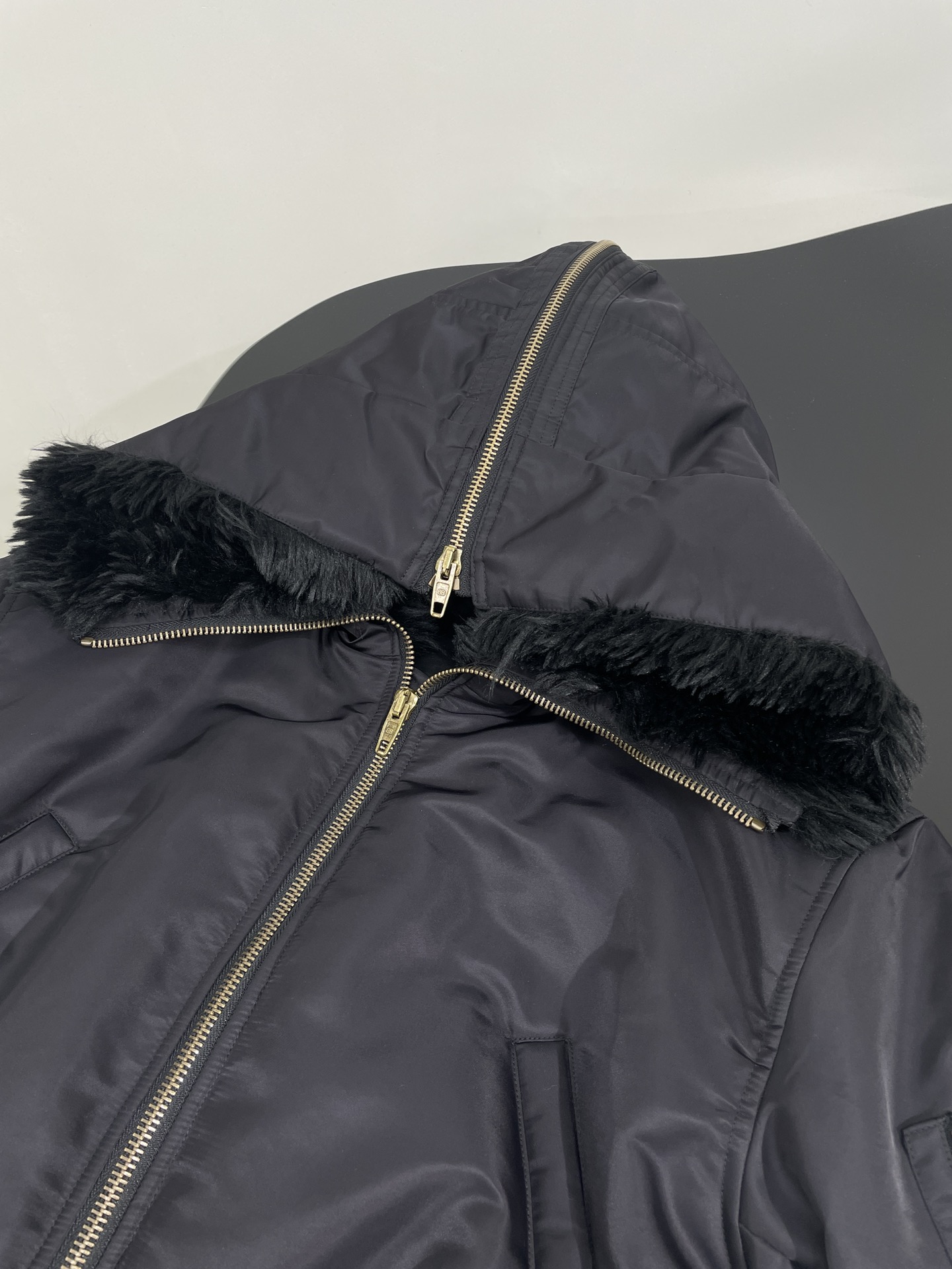 Bagsaaa Ba1en*iaga hooded bomber jacket with a faux fur collar black