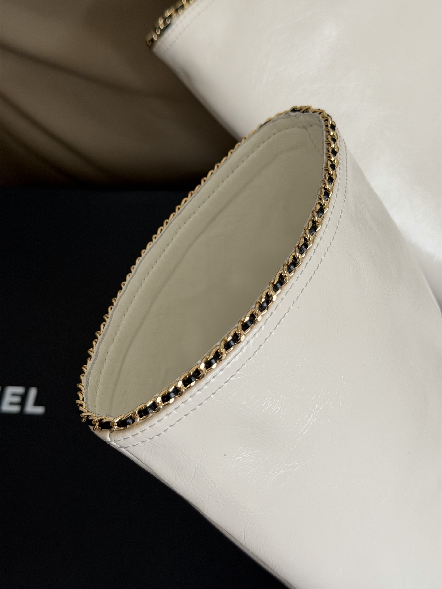 Bagsaaa Ch**el mid-calf boots in white patent leather with black cap toes