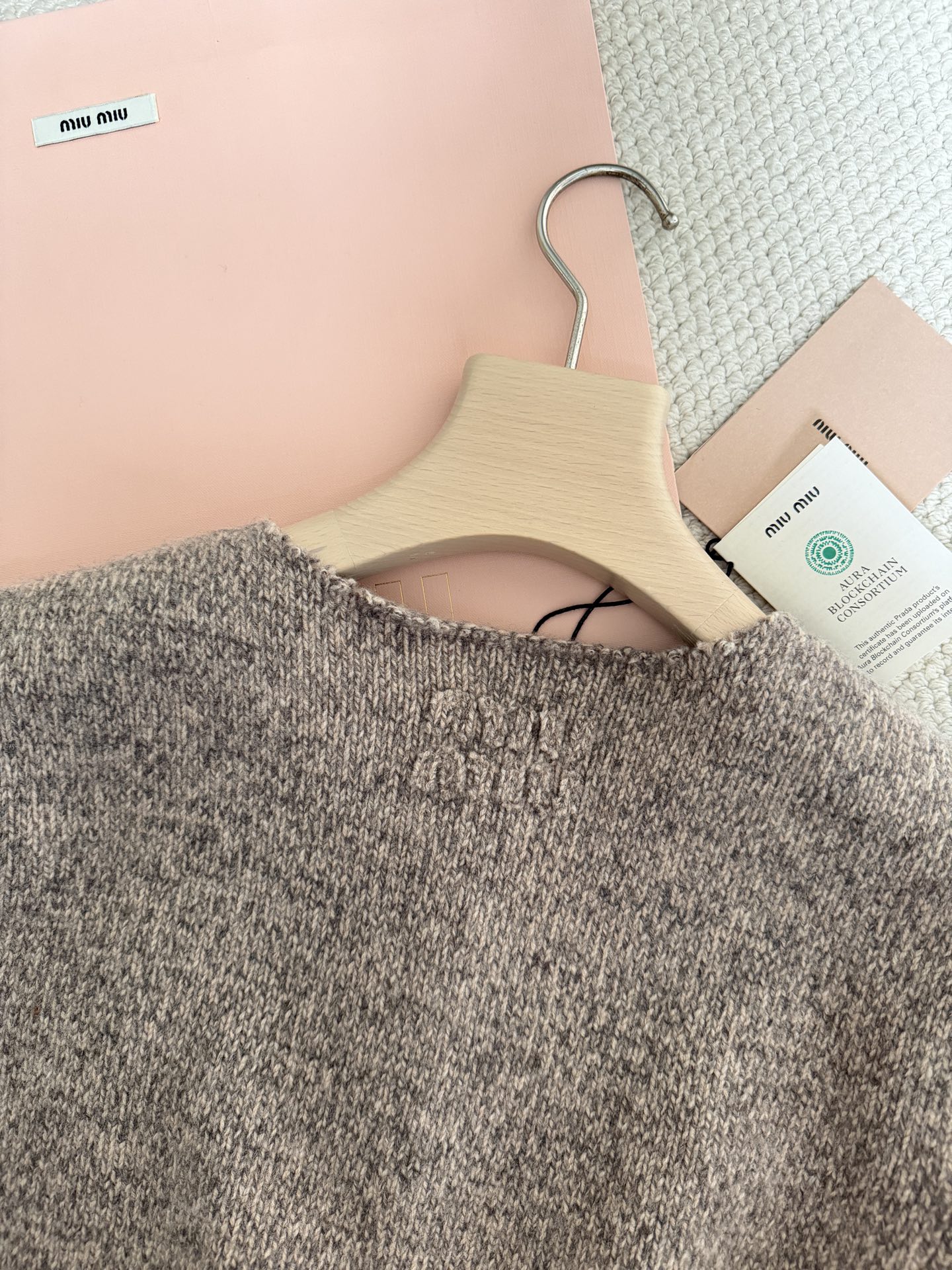 Bagsaaa Miu Miu wool cardigan with a crew neck and pockets